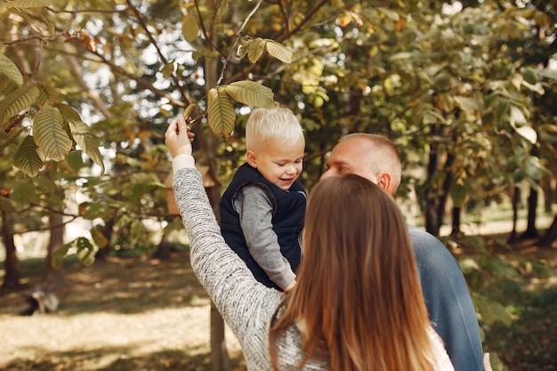 Family with little son in a autumn park