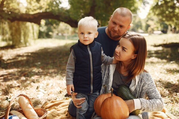 Family with little son in a autumn park