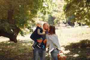 Free photo family with little son in a autumn park