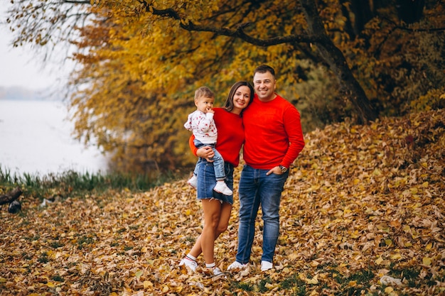 Family with a little son in autumn park