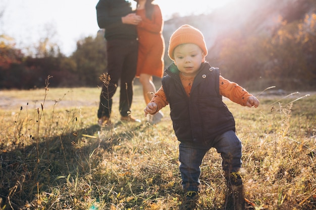 Family with a little son in autumn park