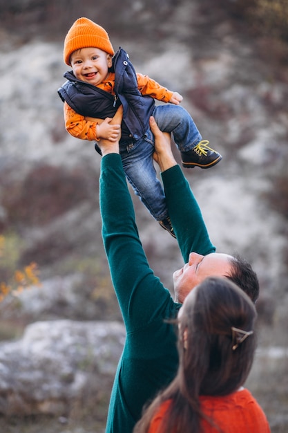 Family with a little son in autumn park