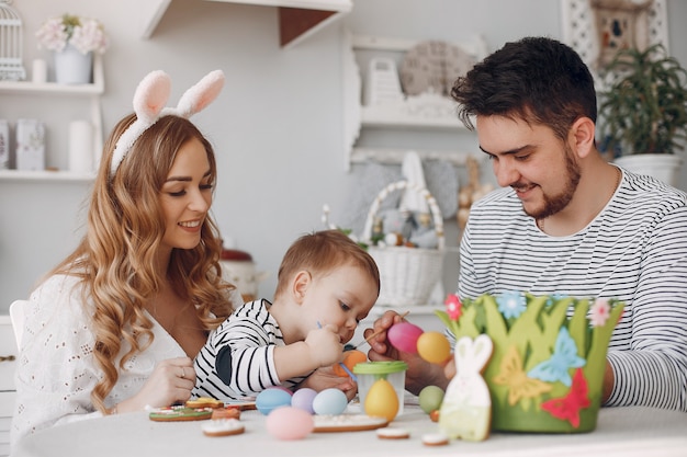 Family with little son painting