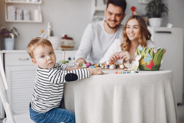 Family with little son painting