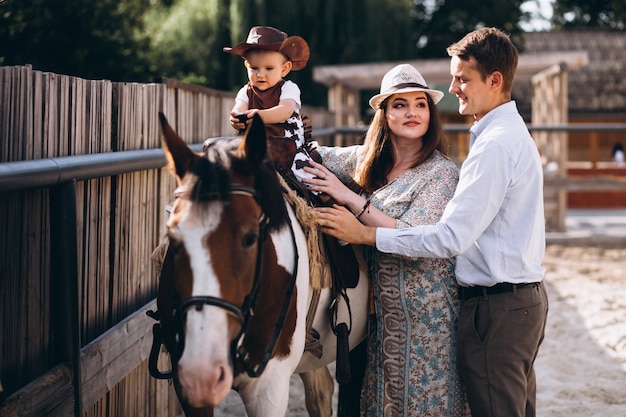 Family with little son at ranch