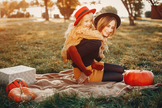 Free photo family with pumpkins