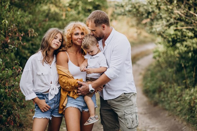 Family with son and daughter together in park