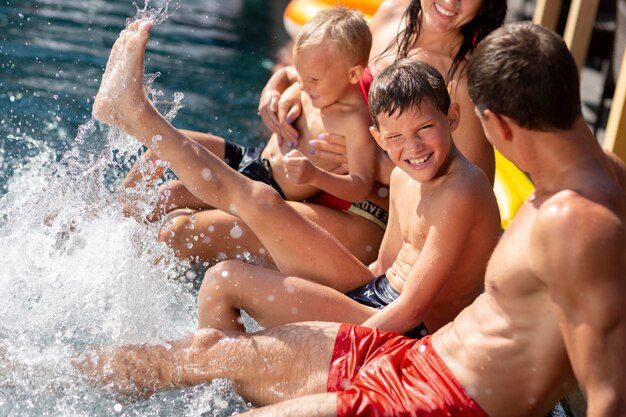 Family with two kids enjoying their day at the swimming pool