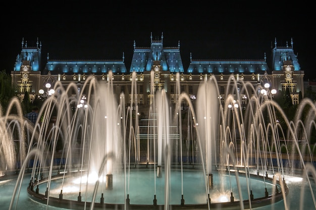 Famous Palace of Culture in Iasi, Romania with fountains in front of it