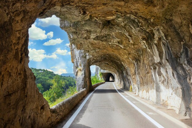 Famous road with arch in the rock called defile de Ruoms at Ruoms