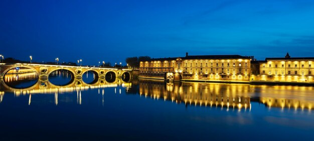 Famous view of Pont Neuf by night Toulouse