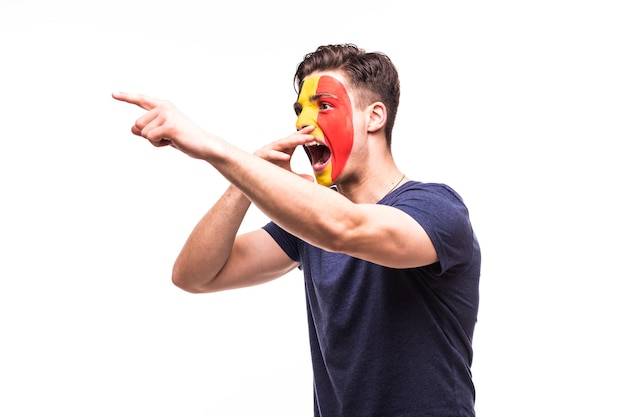 Fan support of Belgium national team with painted face shout and scream isolated on white background