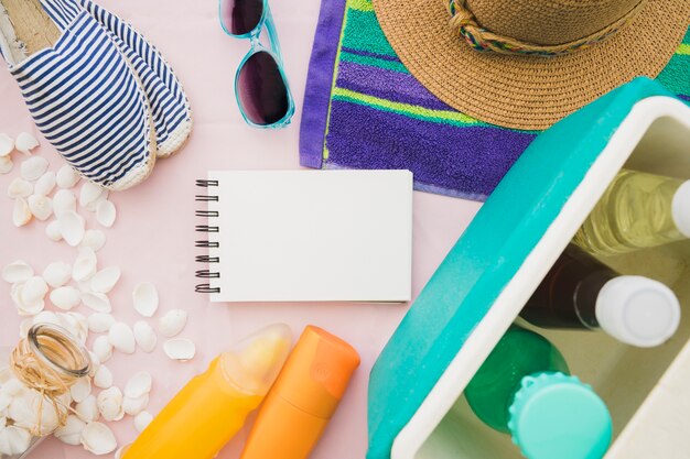 Fantastic composition with blank notebook and summer elements