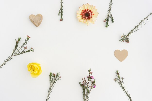 Fantastic frame made of flowers and hearts