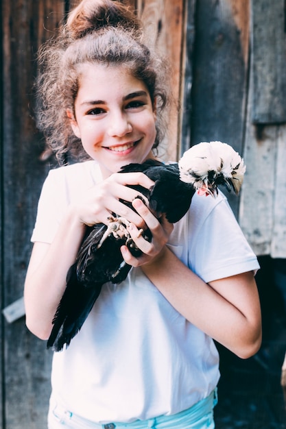 Farm concept with girl holding turkey