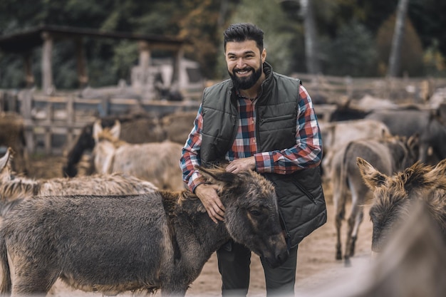 A farmer with his animals at the fram