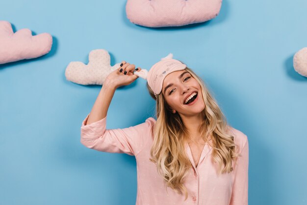 Fascinating blonde woman posing in sleep mask