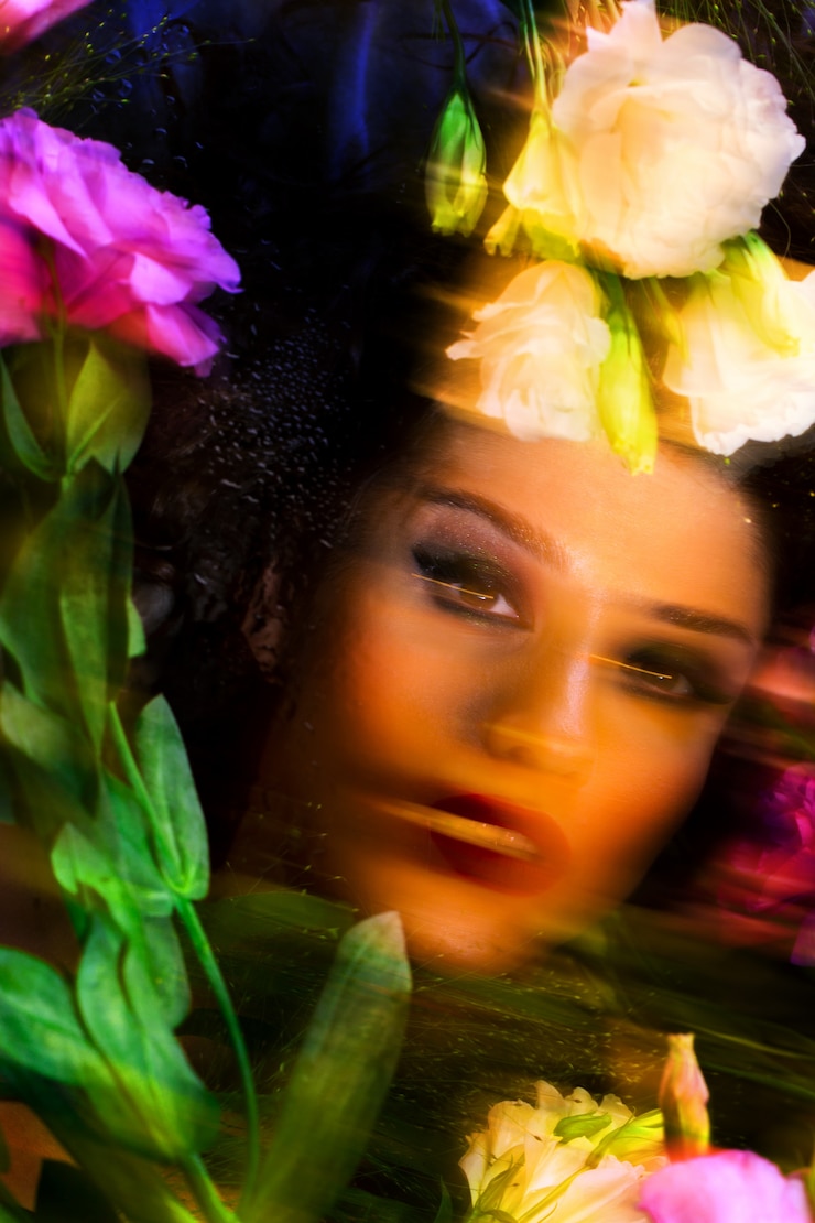 Free Photo fashion beautiful girl with bright make up among eustomas.