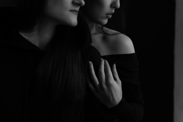 Fashion black and white photo of two beautiful girls