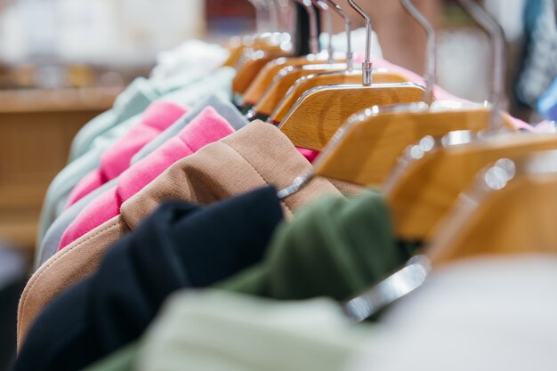 Fashion clothing on hangers at the show