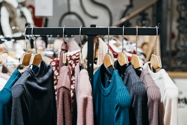 Fashion clothing on hangers at the show