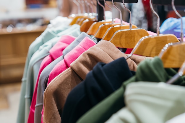 Fashion clothing on hangers at the show