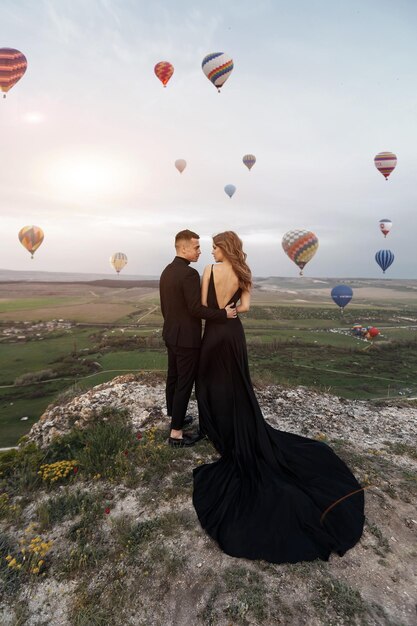 fashion couple in black dress and suit