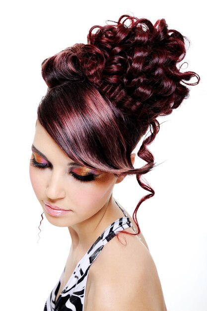 Fashion creative hairstyle on the head of the young beautiful woman