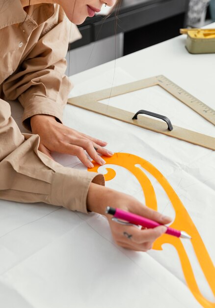 Fashion designer working in her workshop alone