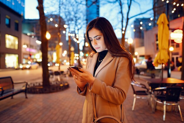 Fashion girl walking in a evening city