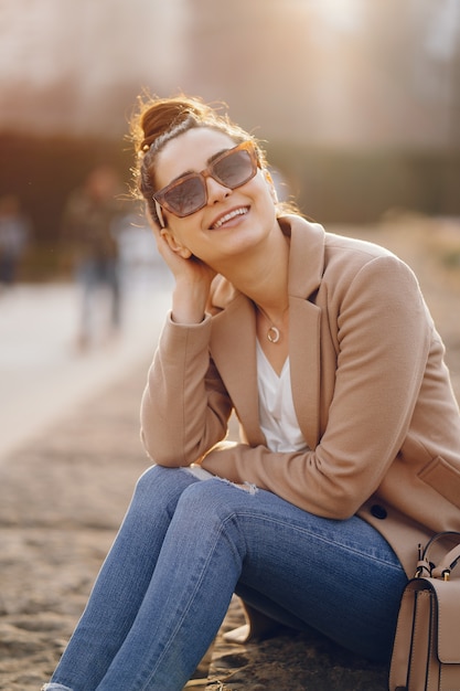 Fashion girl walking in a sspring park