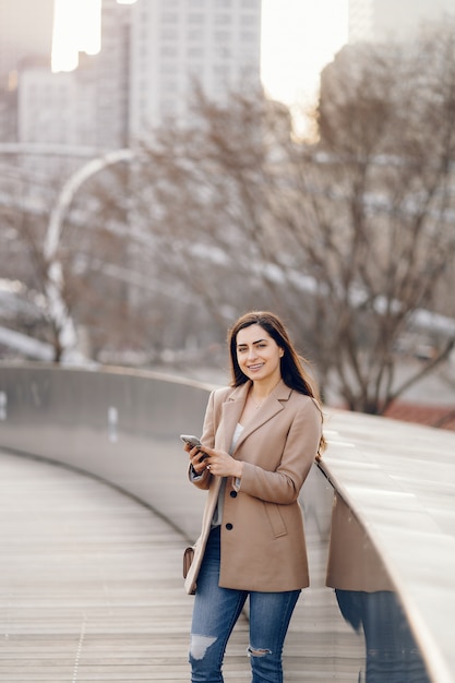 Fashion girl walking in a sspring park