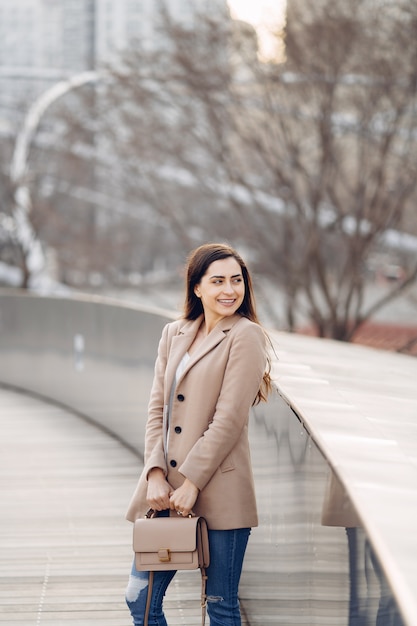 Fashion girl walking in a sspring park