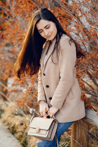 Fashion girl walking in a sspring park