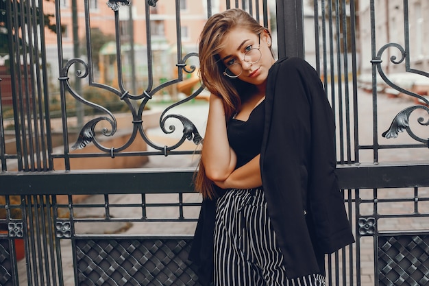 Fashion girl walking in a summer city