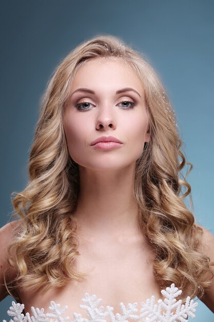 Fashion model with blond curly hairstyle