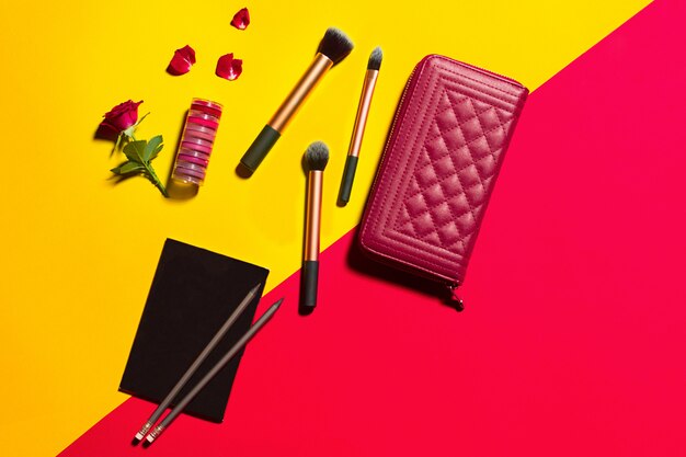 fashion objects on yellow and red table