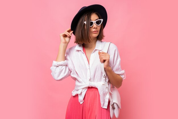 Fashion  photo of lovely brunette woman in  spring outfit posing   Stylish sunglasses.