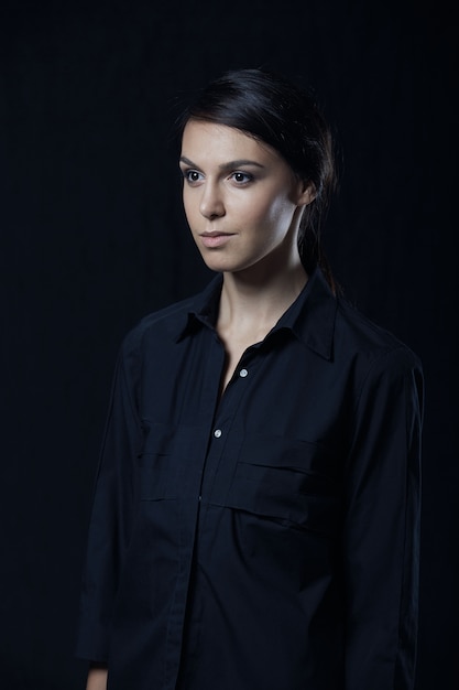 Fashion photo of young magnificent woman in black shirt