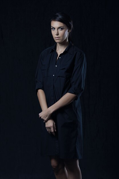 Fashion photo of young magnificent woman in black shirt