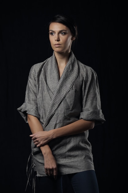 Fashion photo of young magnificent woman in grey shirt