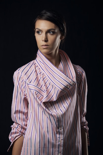 Fashion photo of young magnificent woman in pink shirt