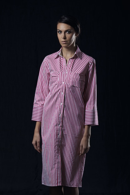 Fashion photo of young magnificent woman in pink shirt