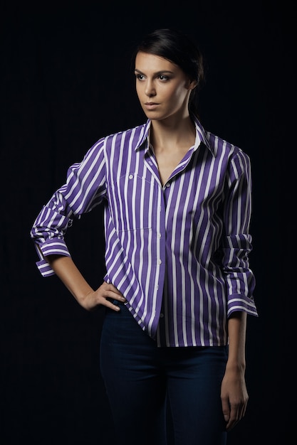 Fashion photo of young magnificent woman in purple shirt