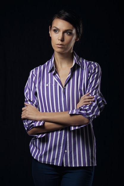 Fashion photo of young magnificent woman in purple shirt