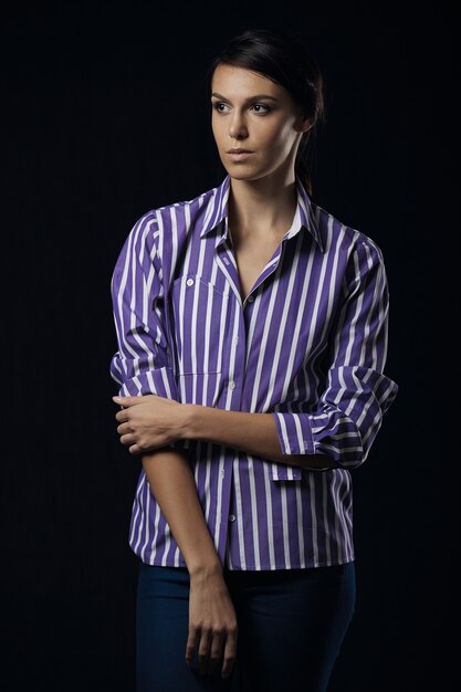 Fashion photo of young magnificent woman in purple shirt