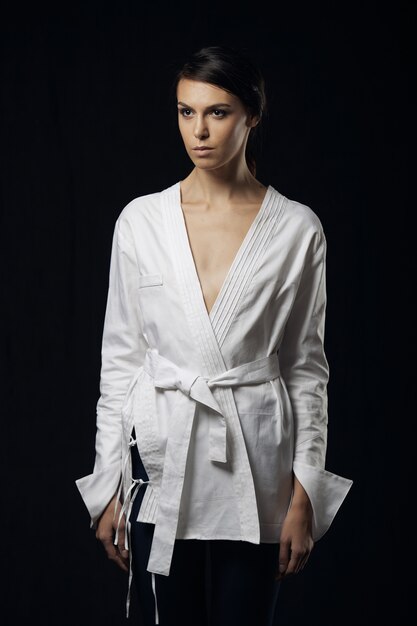 Fashion photo of young magnificent woman in white shirt