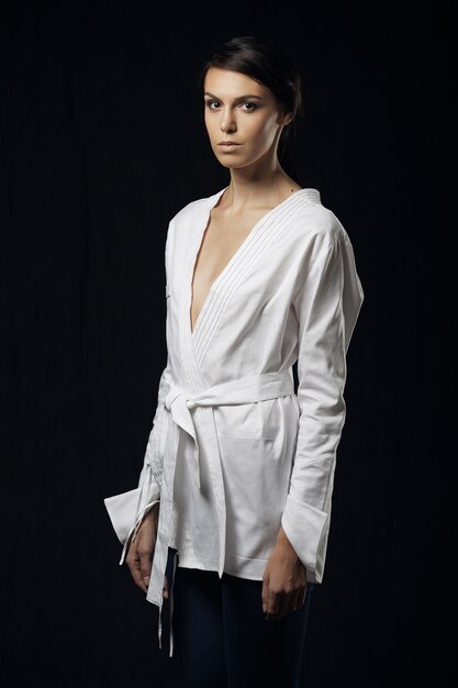 Fashion photo of young magnificent woman in white shirt