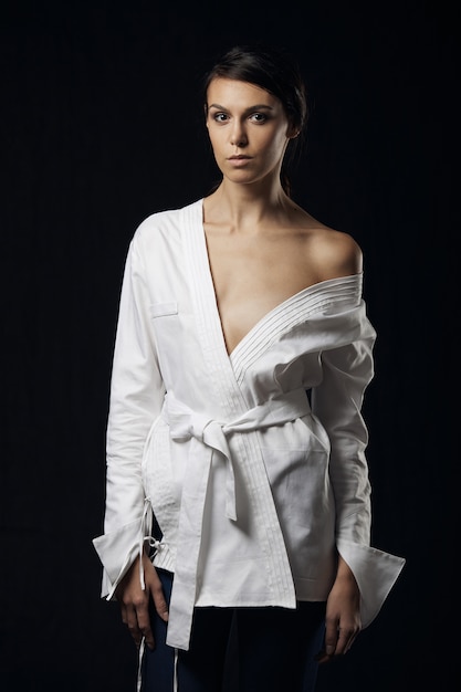 Fashion photo of young magnificent woman in white shirt