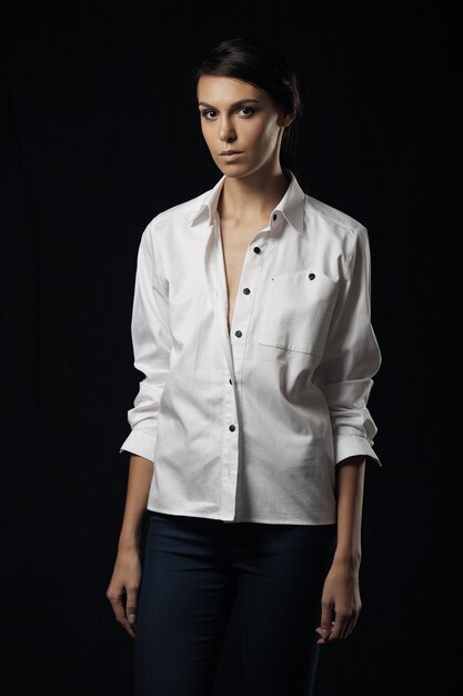 Fashion photo of young magnificent woman in white shirt